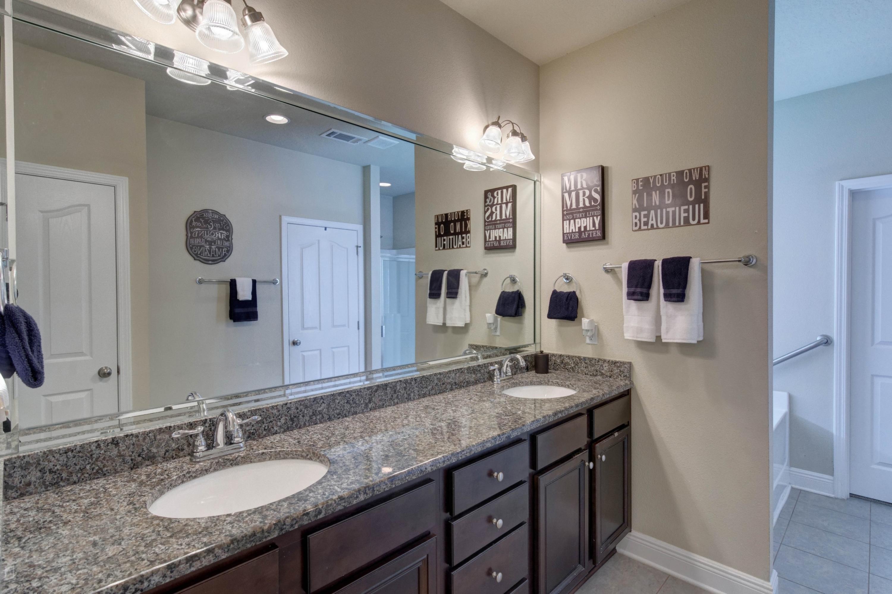 646 Red Fern Road Crestview, FL 32536 - Photo 38 of 64 a bathroom with a granite countertop double vanity sink and a mirror