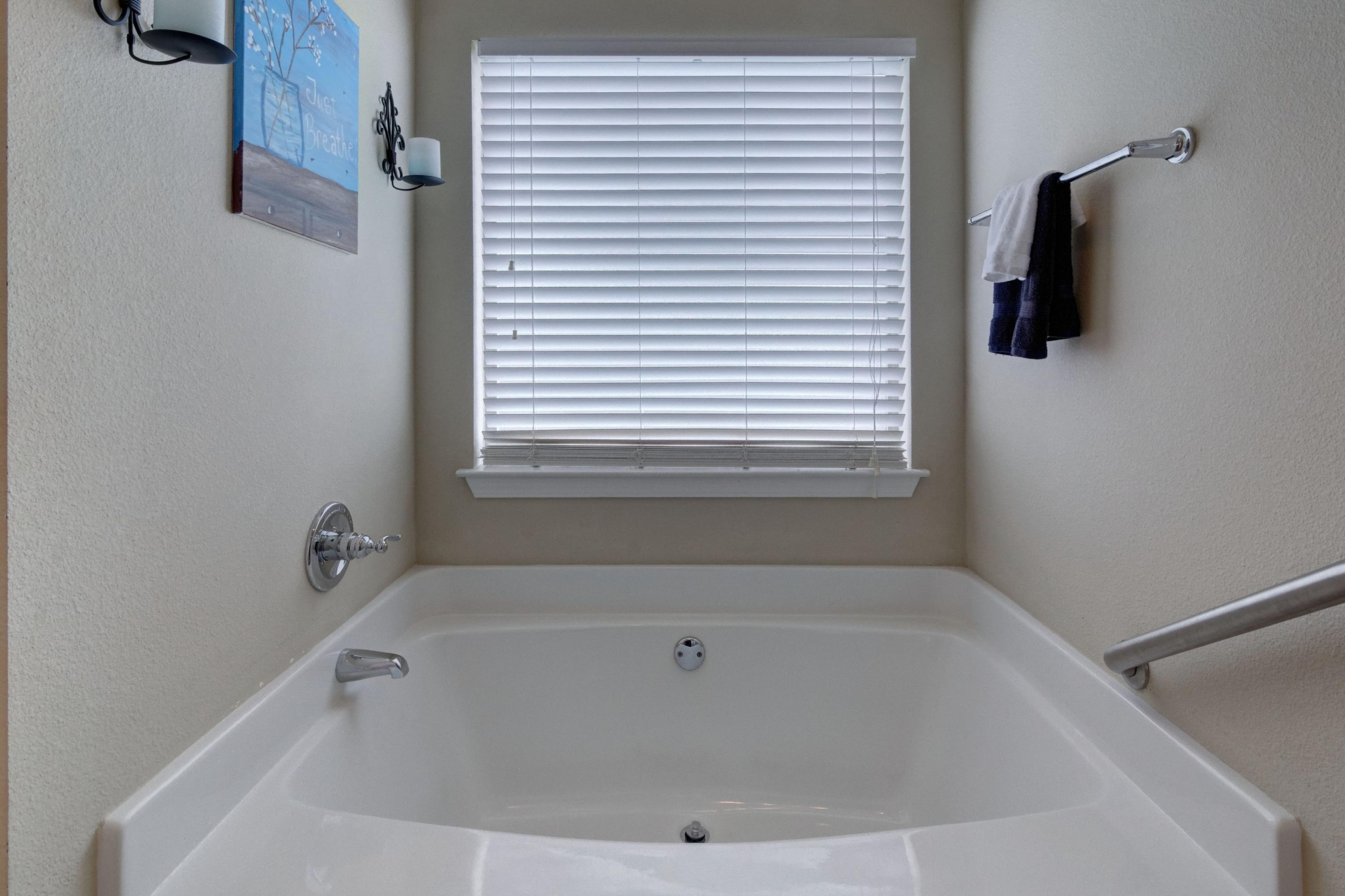 646 Red Fern Road Crestview, FL 32536 - Photo 40 of 64 a white bath tub sitting next to a window