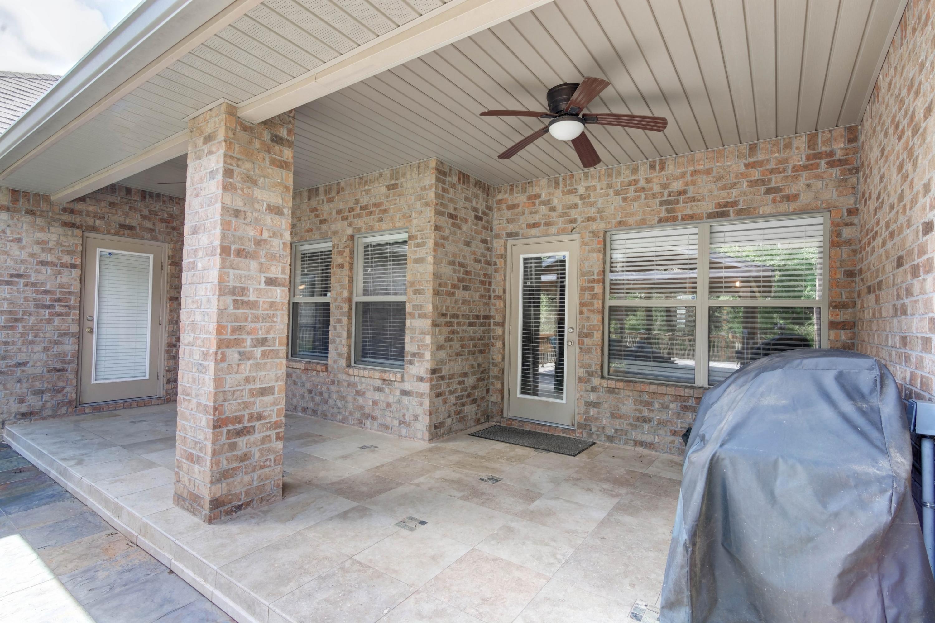 646 Red Fern Road Crestview, FL 32536 - Photo 52 of 64 a view of a porch with furniture and front door