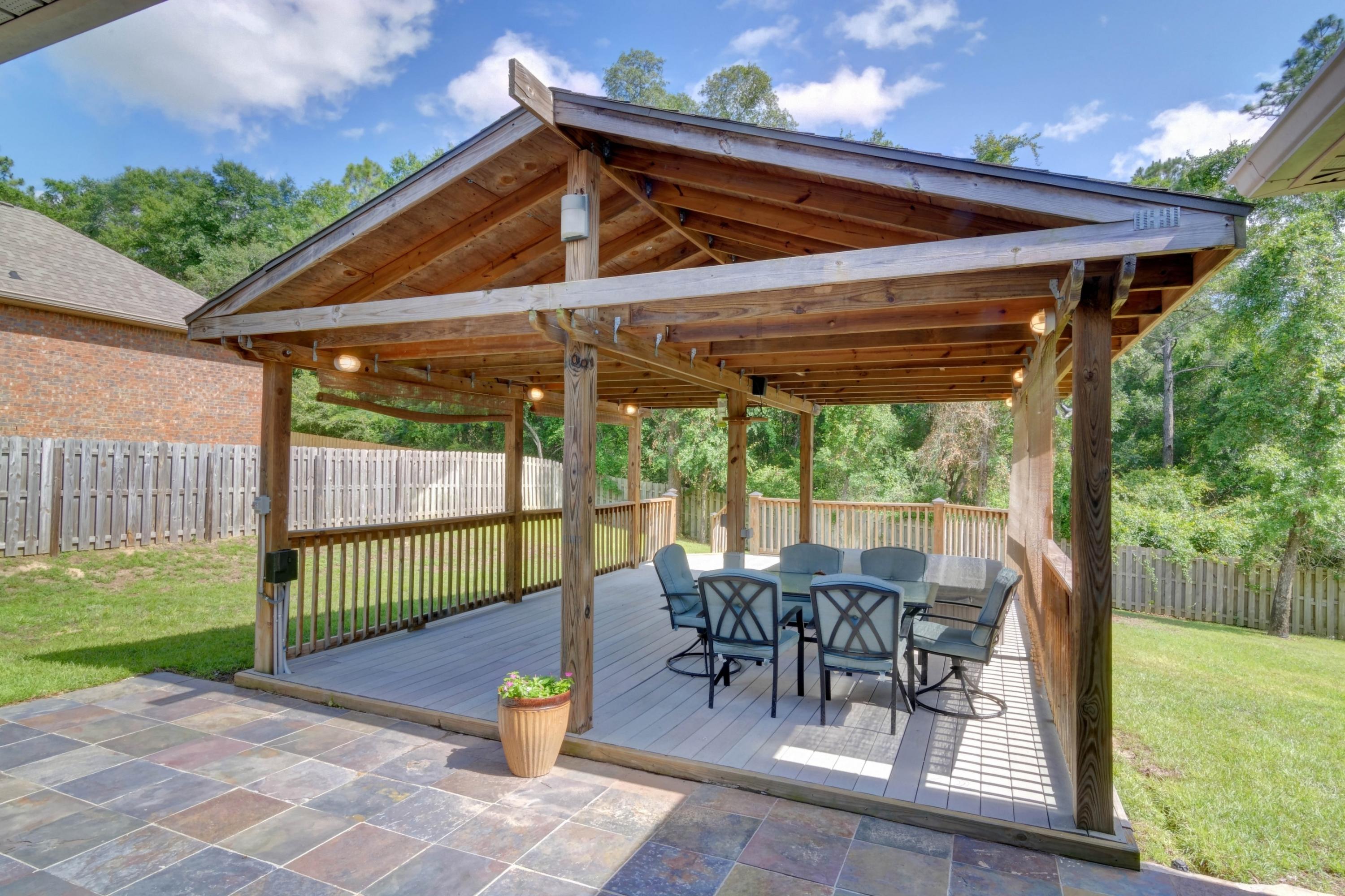 646 Red Fern Road Crestview, FL 32536 - Photo 54 of 64 a patio with glass top table and chairs