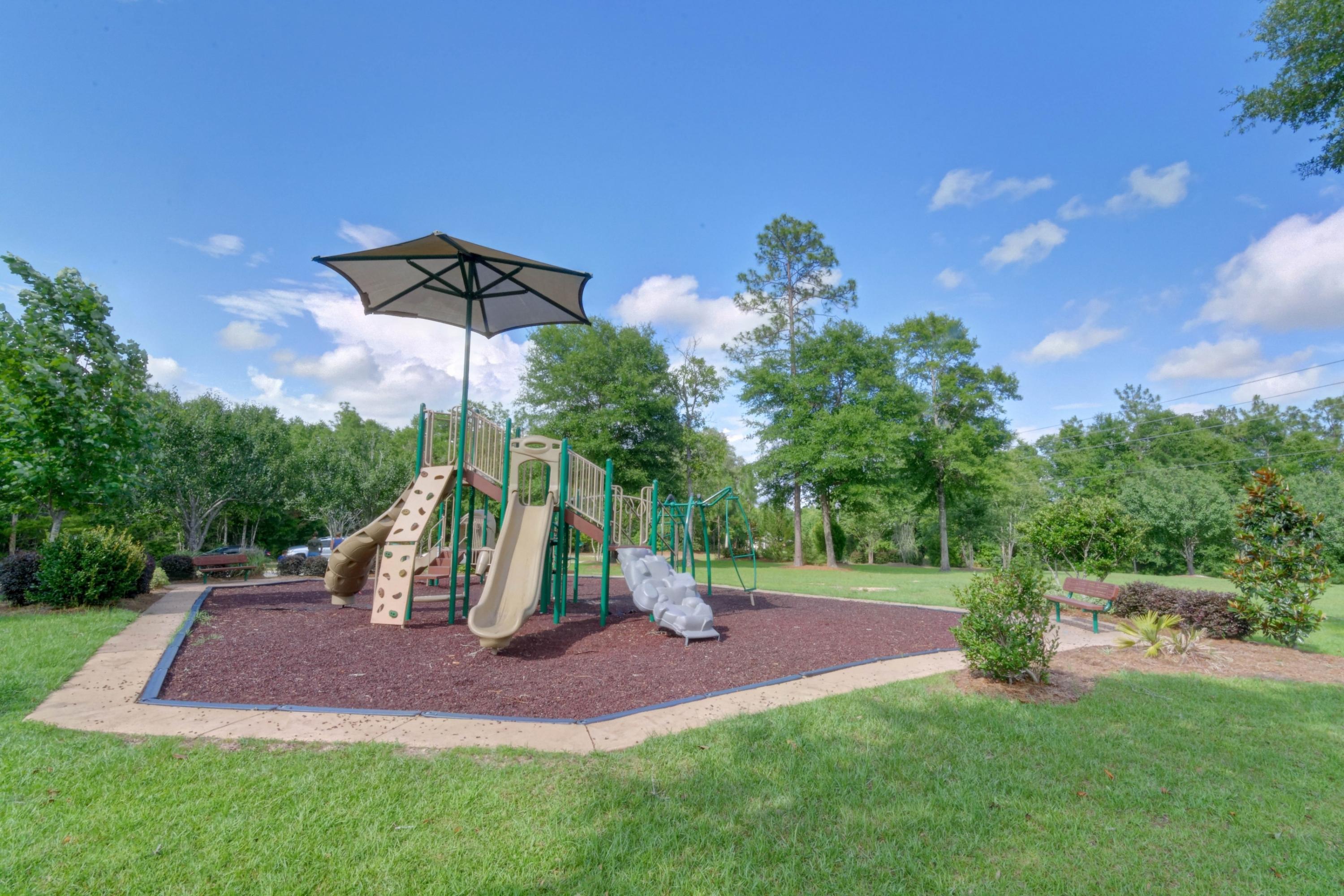 646 Red Fern Road Crestview, FL 32536 - Photo 62 of 64 a view of outdoor space with playground and green space