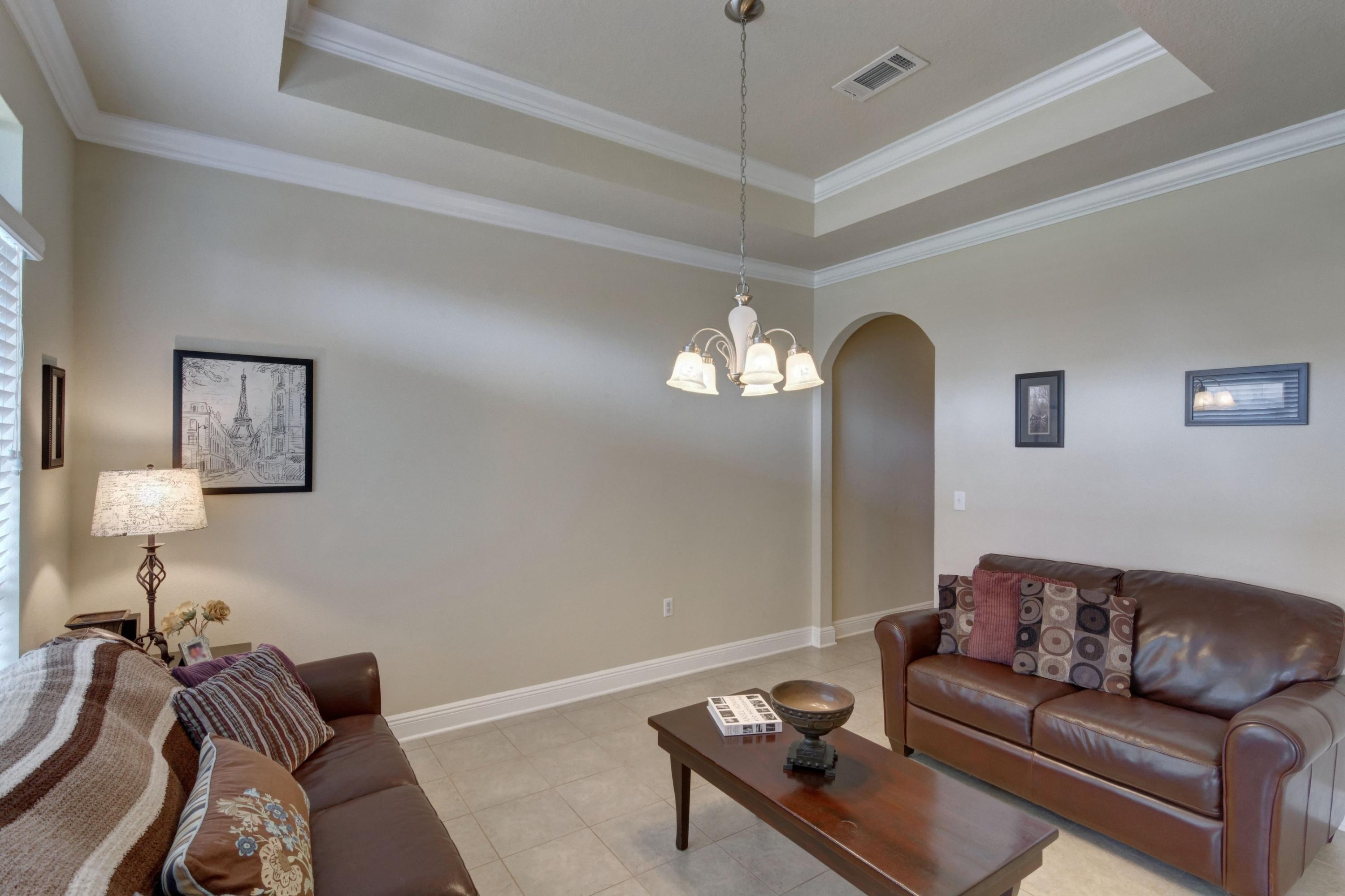 646 Red Fern Road Crestview, FL 32536 - Photo 9 of 64 a living room with furniture and a chandelier