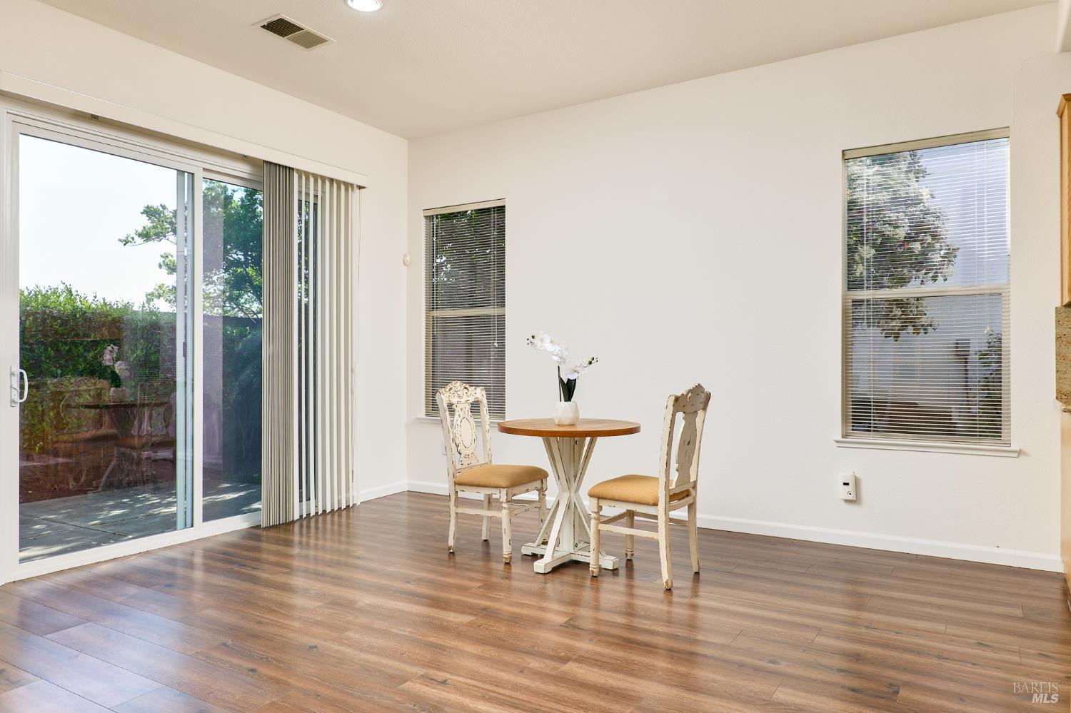 604 American Falls Drive Rio Vista, CA 94571 - Photo 13 of 39 a dining room with wooden floor and glass door