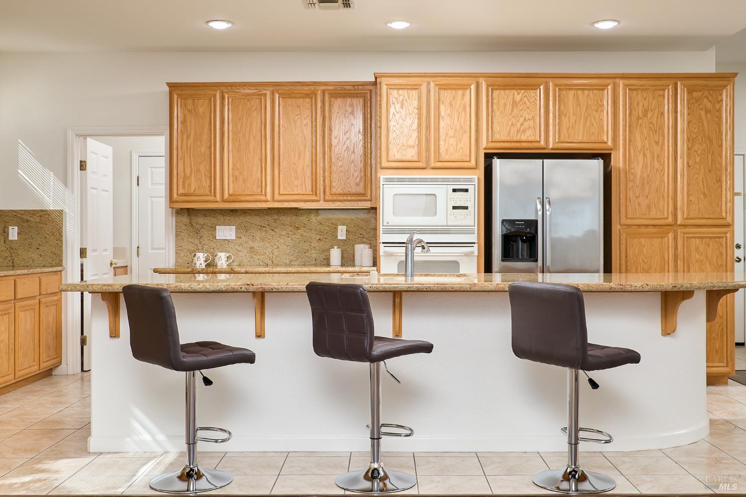 604 American Falls Drive Rio Vista, CA 94571 - Photo 15 of 39 a kitchen with stainless steel appliances granite countertop a stove a sink and a cabinets
