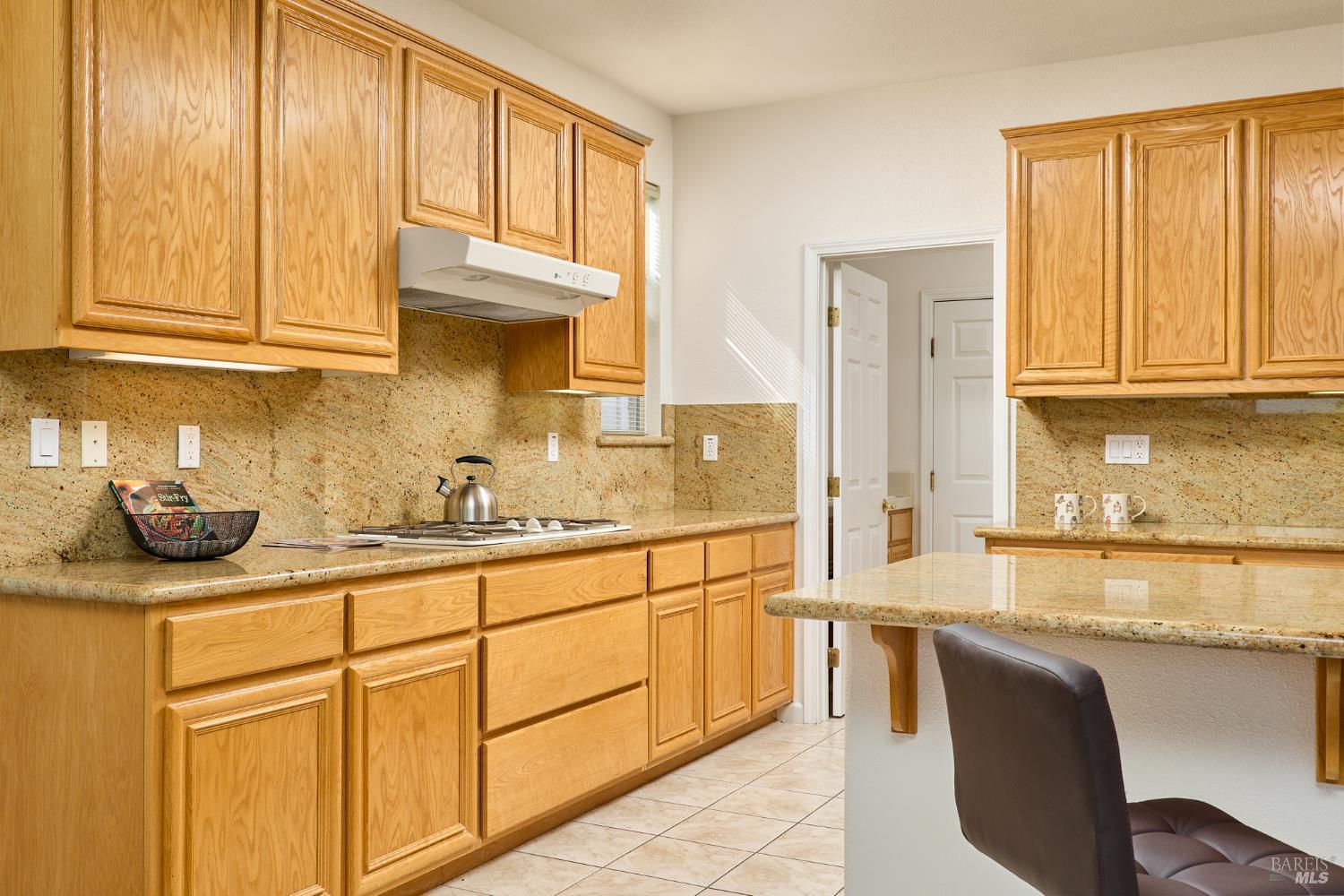 604 American Falls Drive Rio Vista, CA 94571 - Photo 16 of 39 a kitchen with stainless steel appliances granite countertop a sink and cabinets