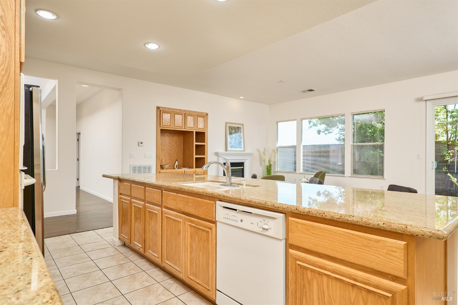 604 American Falls Drive Rio Vista, CA 94571 - Photo 19 of 39 a large kitchen with granite countertop a sink and dishwasher with a large kitchen island