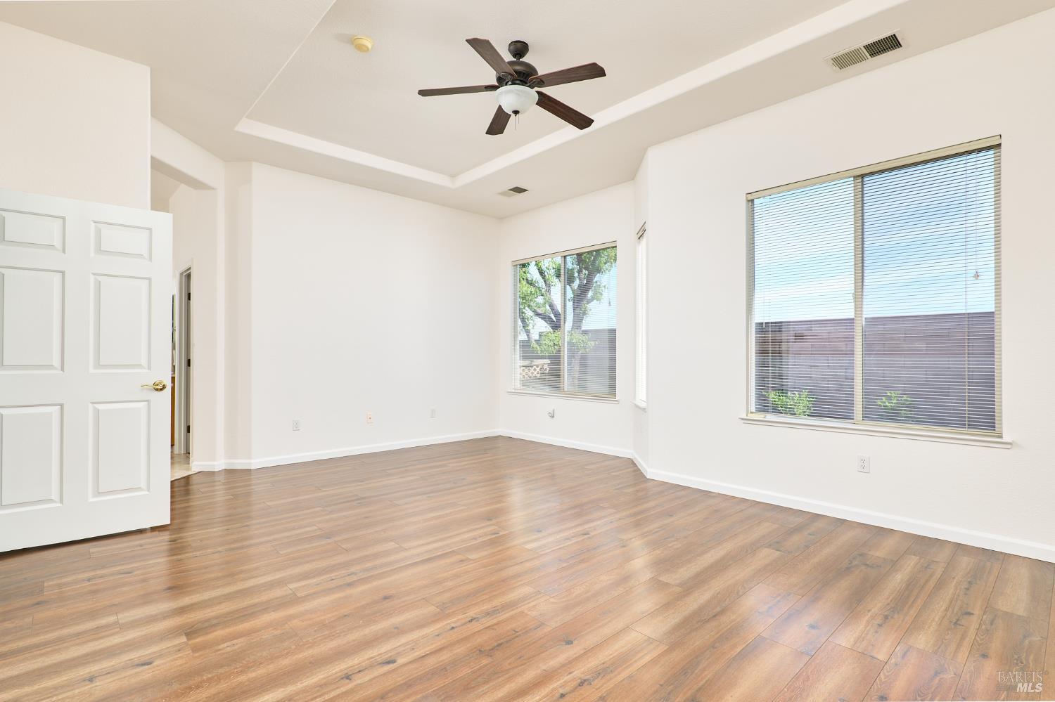 604 American Falls Drive Rio Vista, CA 94571 - Photo 20 of 39 a view of an empty room with a window and wooden floor