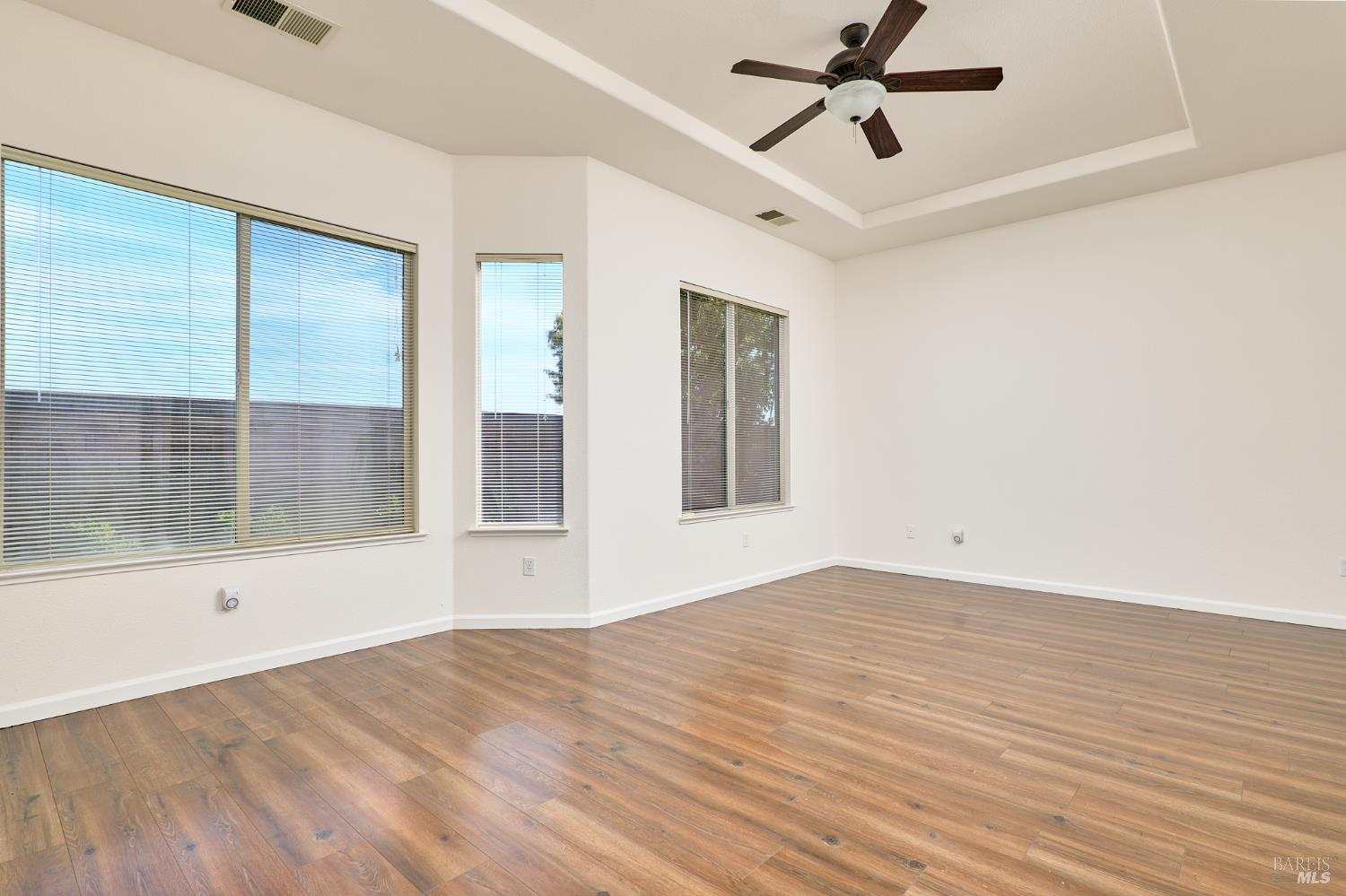 604 American Falls Drive Rio Vista, CA 94571 - Photo 21 of 39 a view of empty room with wooden floor and fan