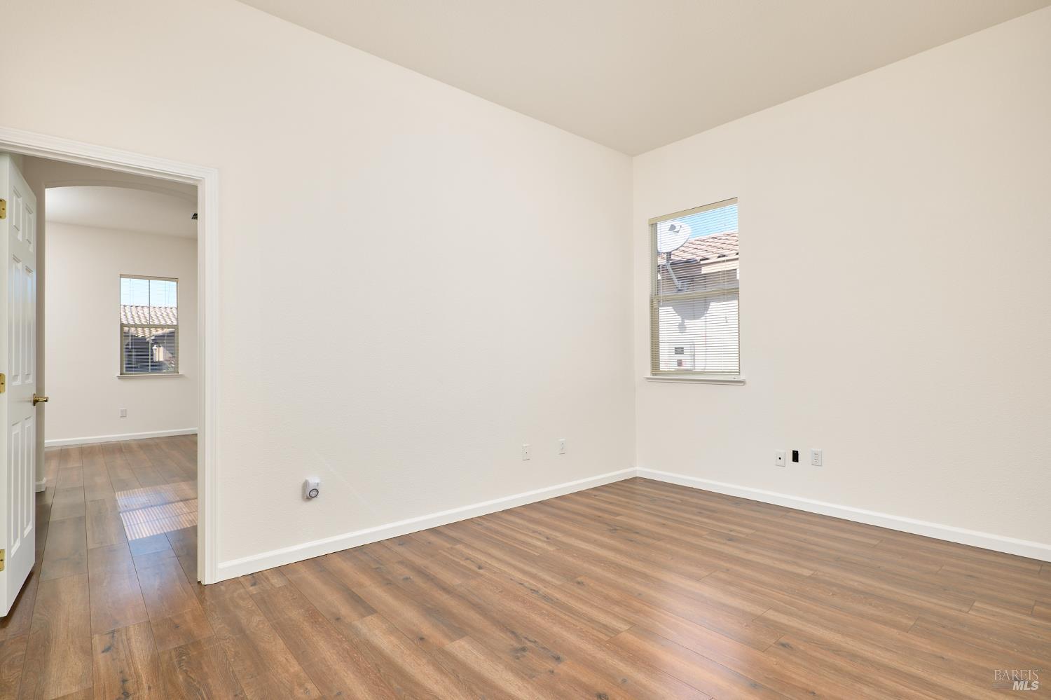 604 American Falls Drive Rio Vista, CA 94571 - Photo 28 of 39 a view of a room with wooden floor and white walls