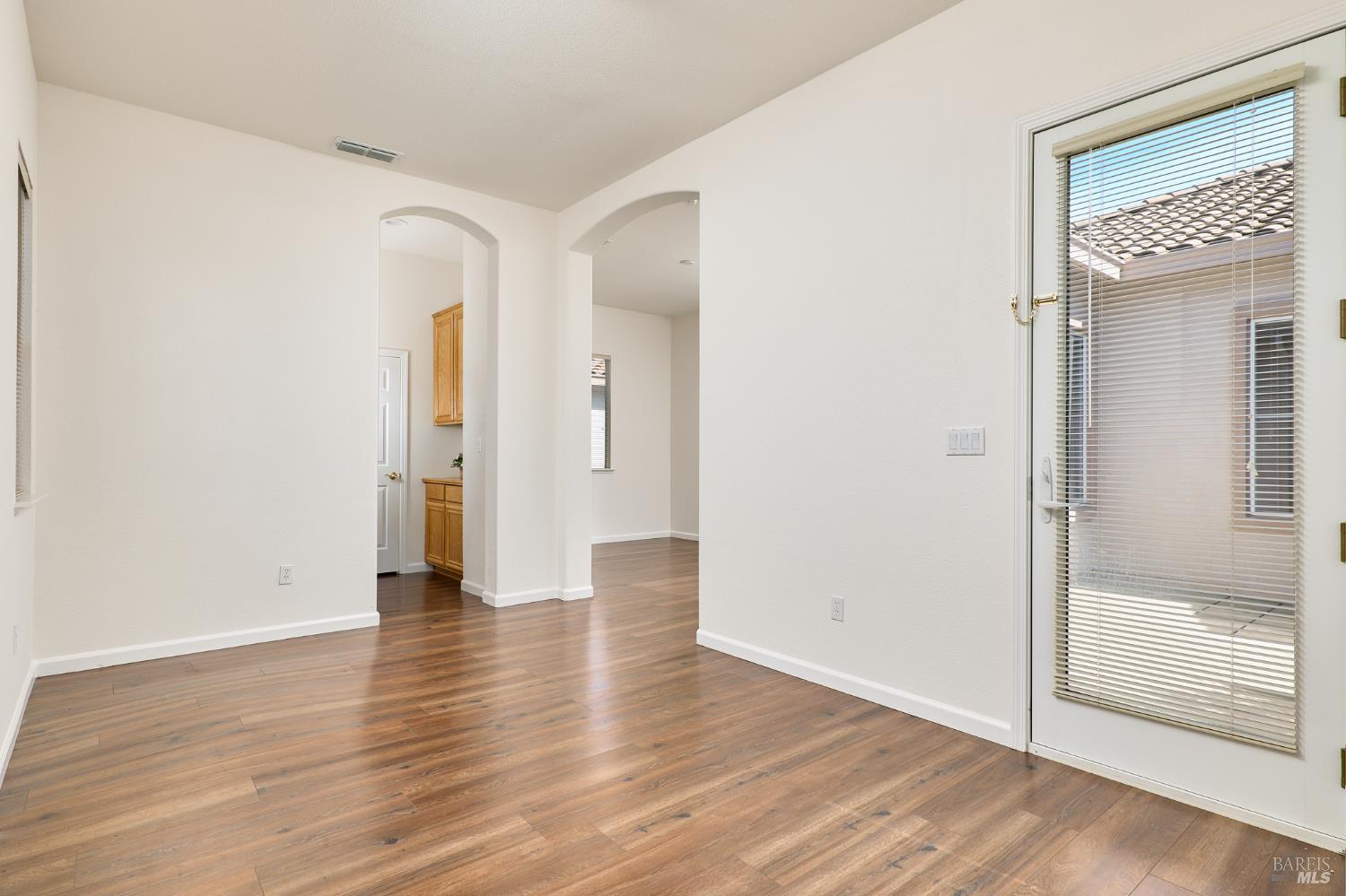 604 American Falls Drive Rio Vista, CA 94571 - Photo 30 of 39 a view of an empty room with wooden floor and a mirror