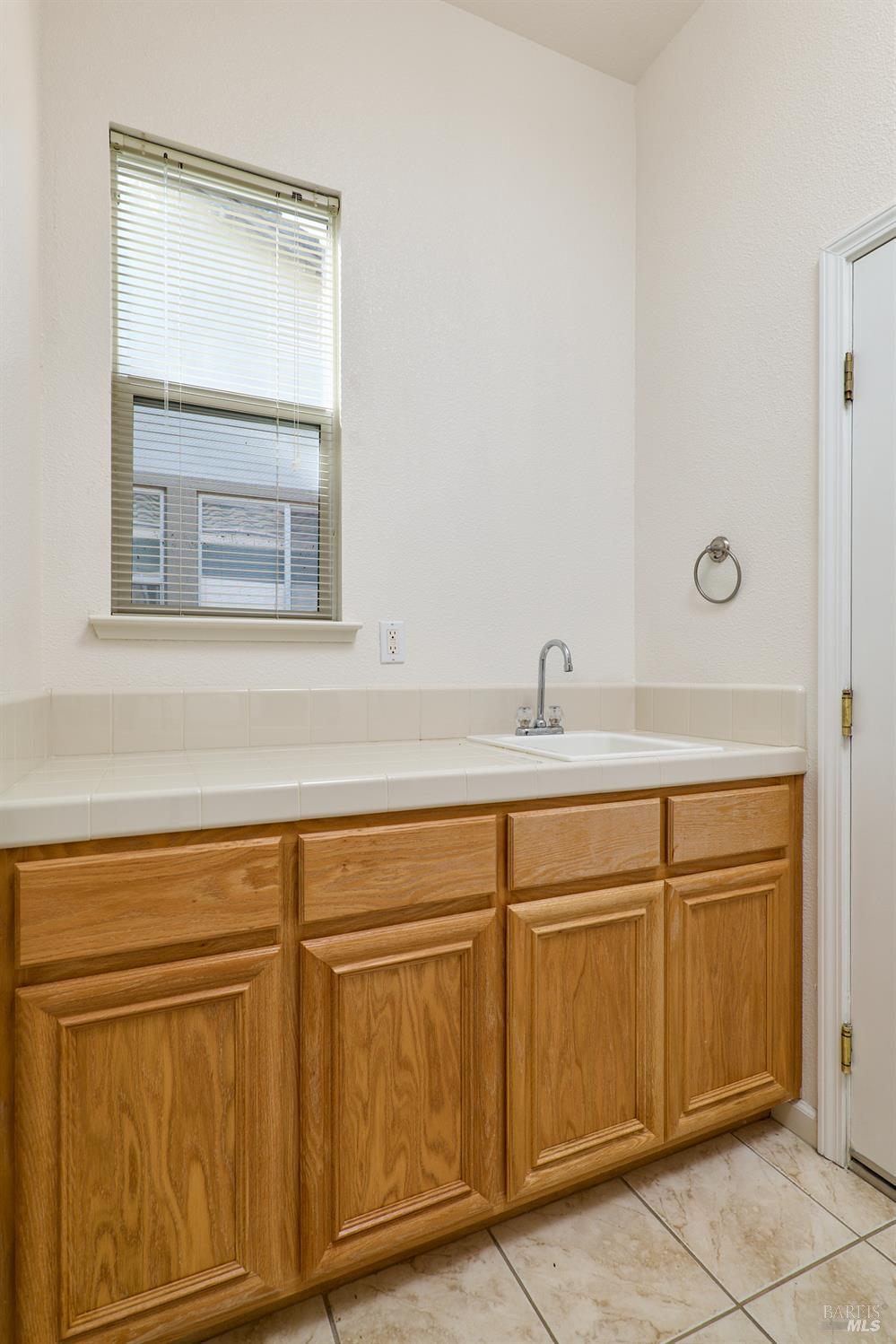 604 American Falls Drive Rio Vista, CA 94571 - Photo 34 of 39 a close view of two sink and a mirror