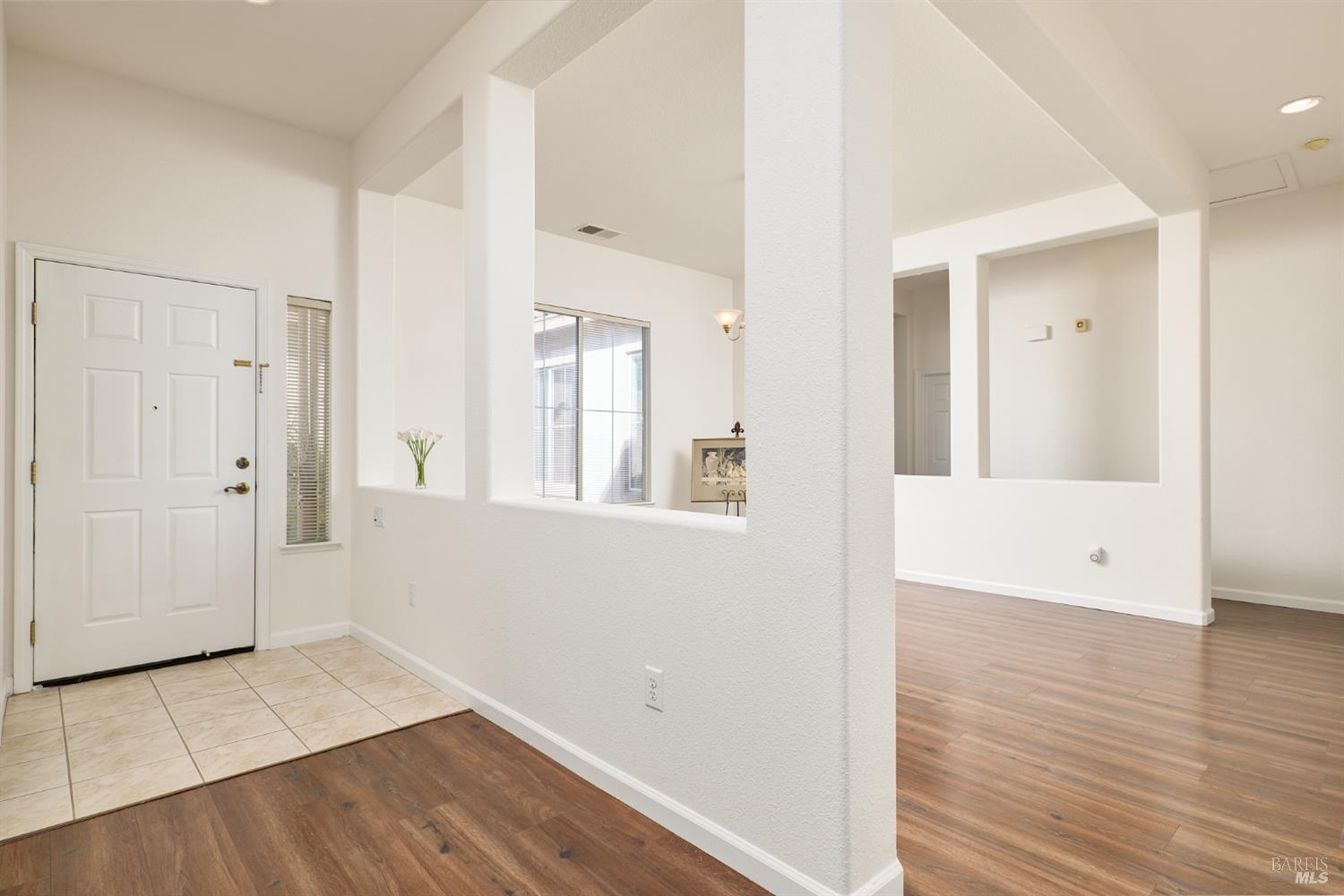 604 American Falls Drive Rio Vista, CA 94571 - Photo 5 of 39 a view of a room with wooden floor and windows