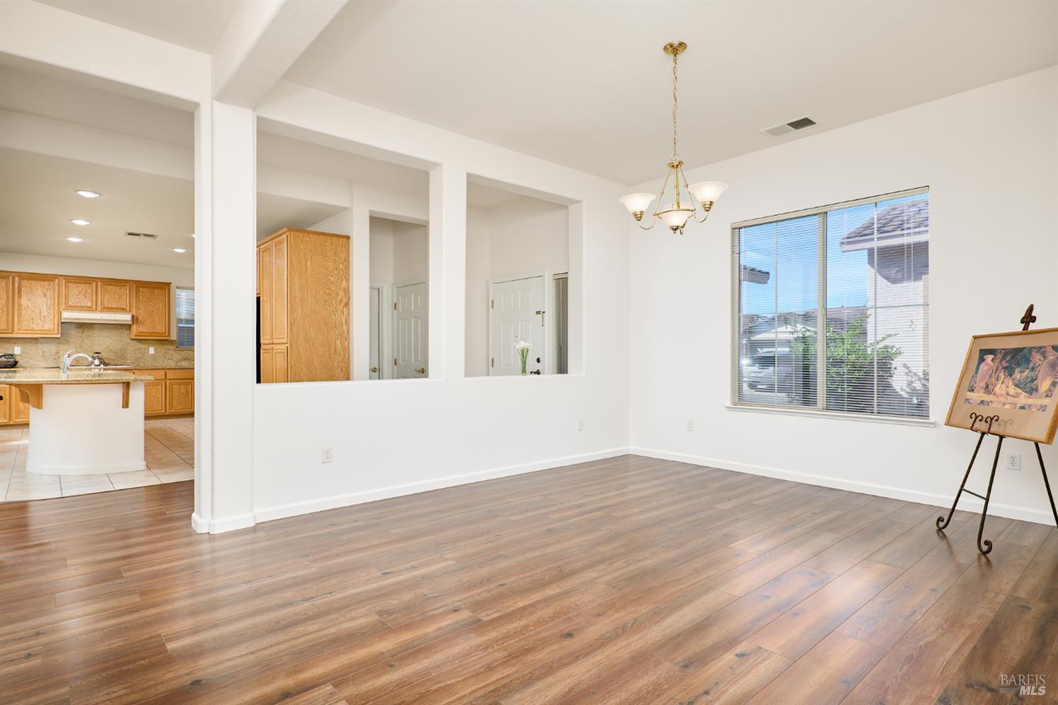 604 American Falls Drive Rio Vista, CA 94571 - Photo 6 of 39 a view of an empty room with wooden floor and a window