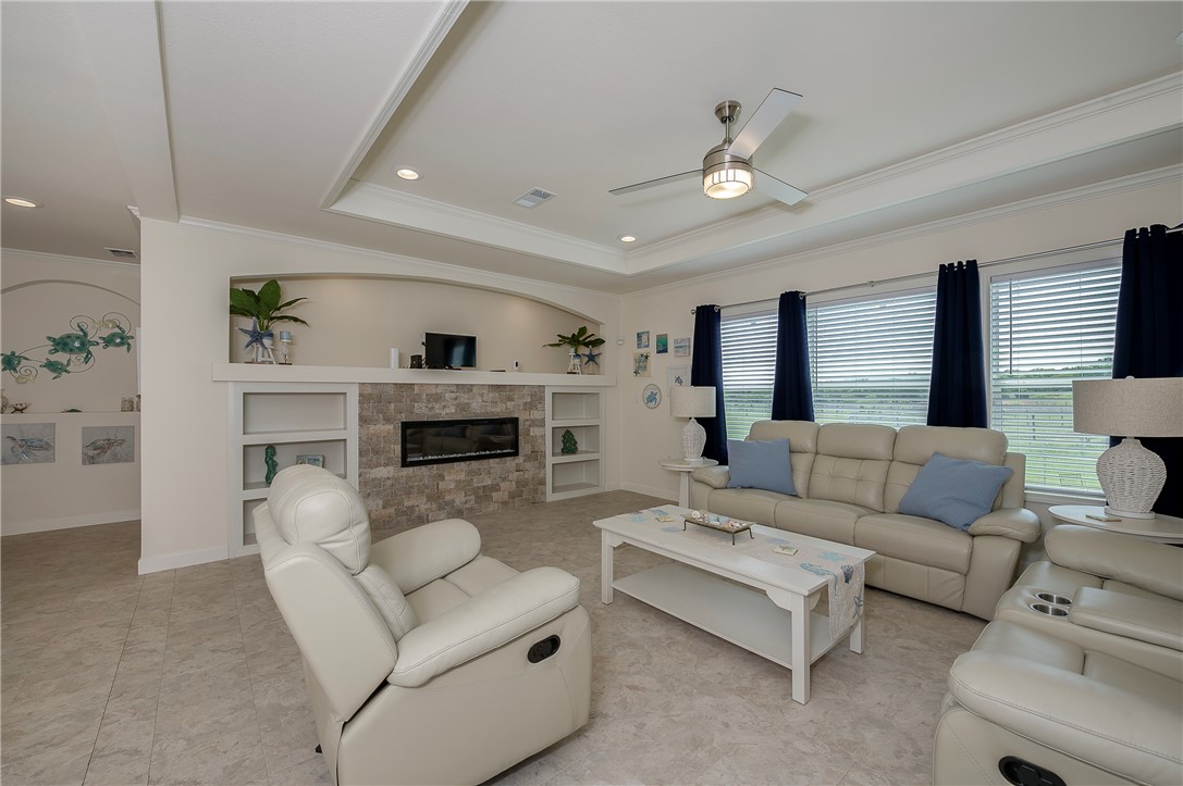 10976 Whiterock Road Bremond, TX 76629 - Photo 14 of 42 a living room with furniture and a fireplace