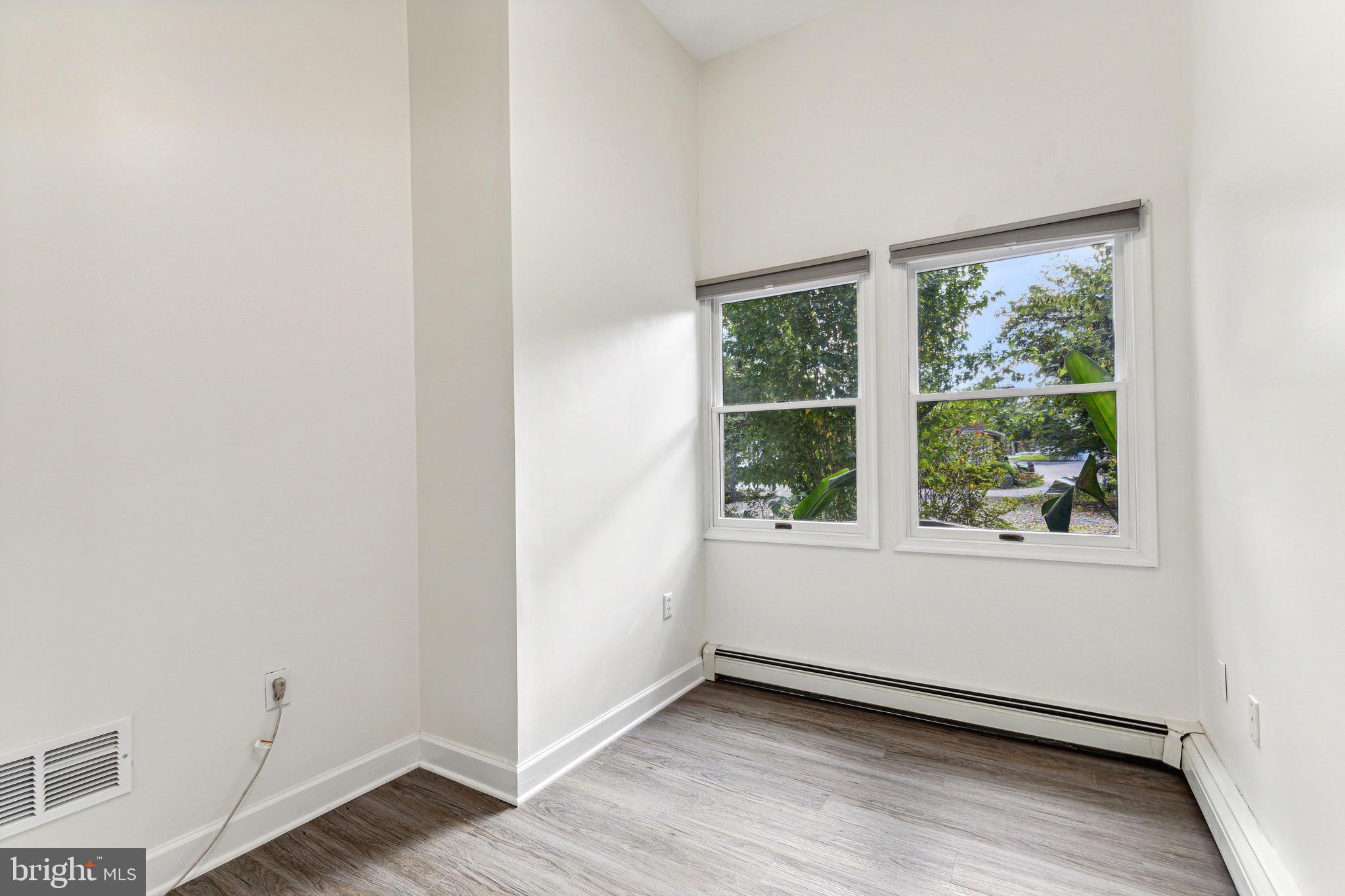 1500 St Margarets Road Annapolis, MD 21409 - Photo 13 of 18 an empty room with wooden floor and windows