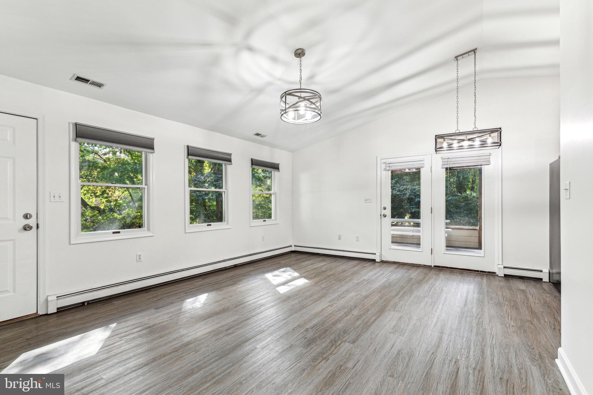 1500 St Margarets Road Annapolis, MD 21409 - Photo 4 of 18 a view of an empty room with wooden floor and a window