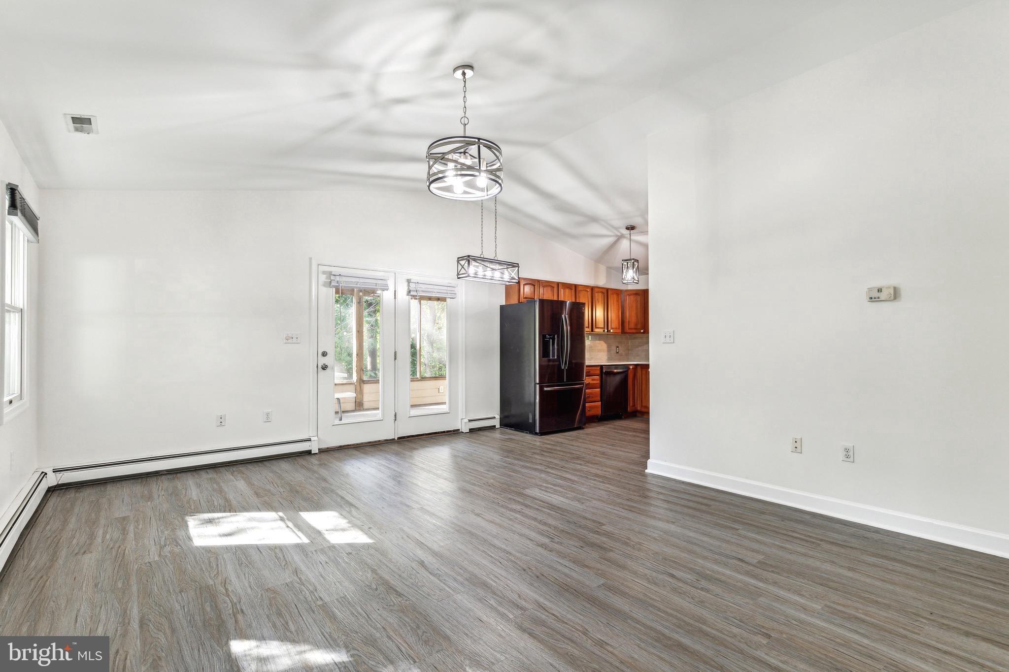 1500 St Margarets Road Annapolis, MD 21409 - Photo 5 of 18 an empty room with wooden floor closet and windows