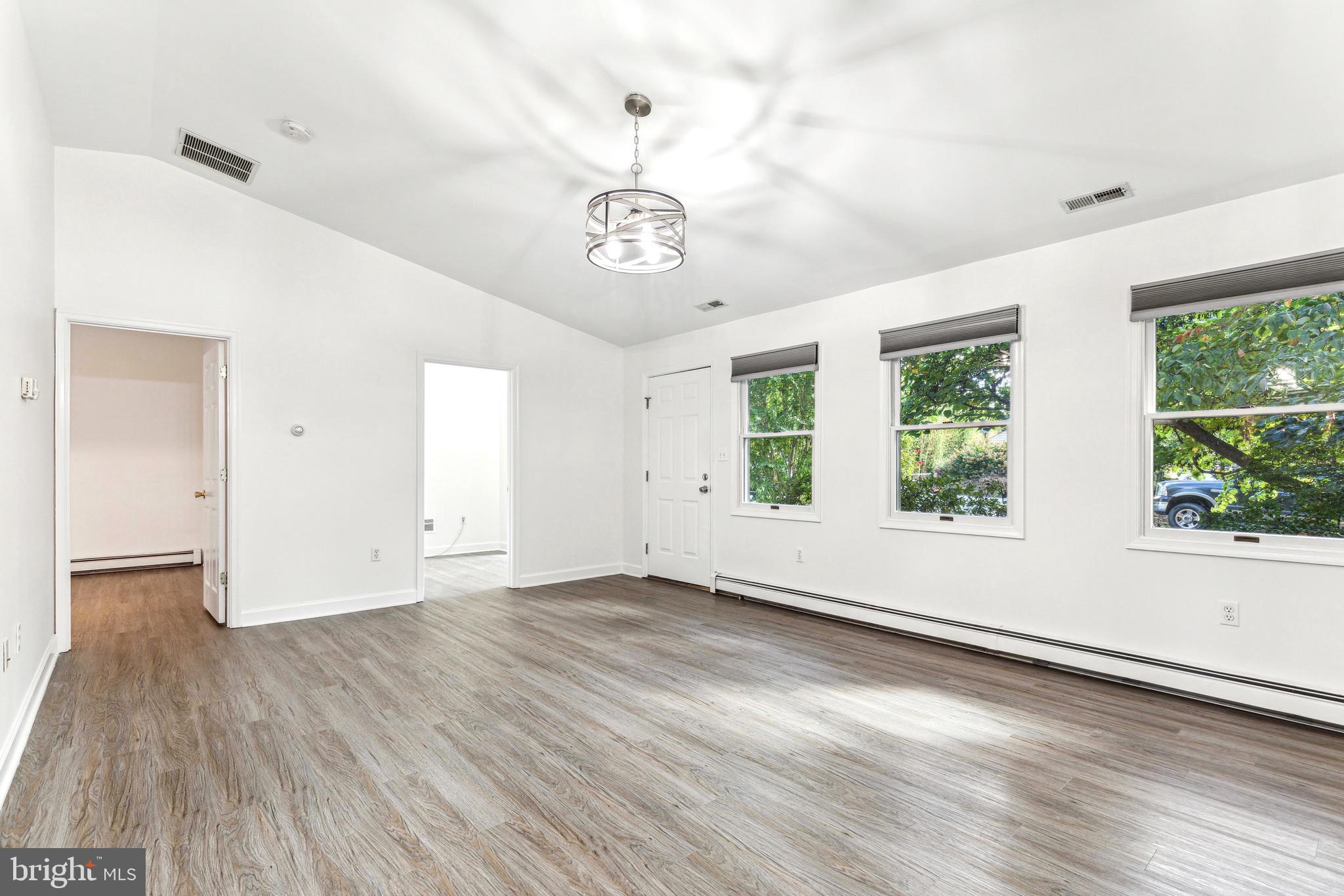 1500 St Margarets Road Annapolis, MD 21409 - Photo 7 of 18 an empty room with wooden floor and windows