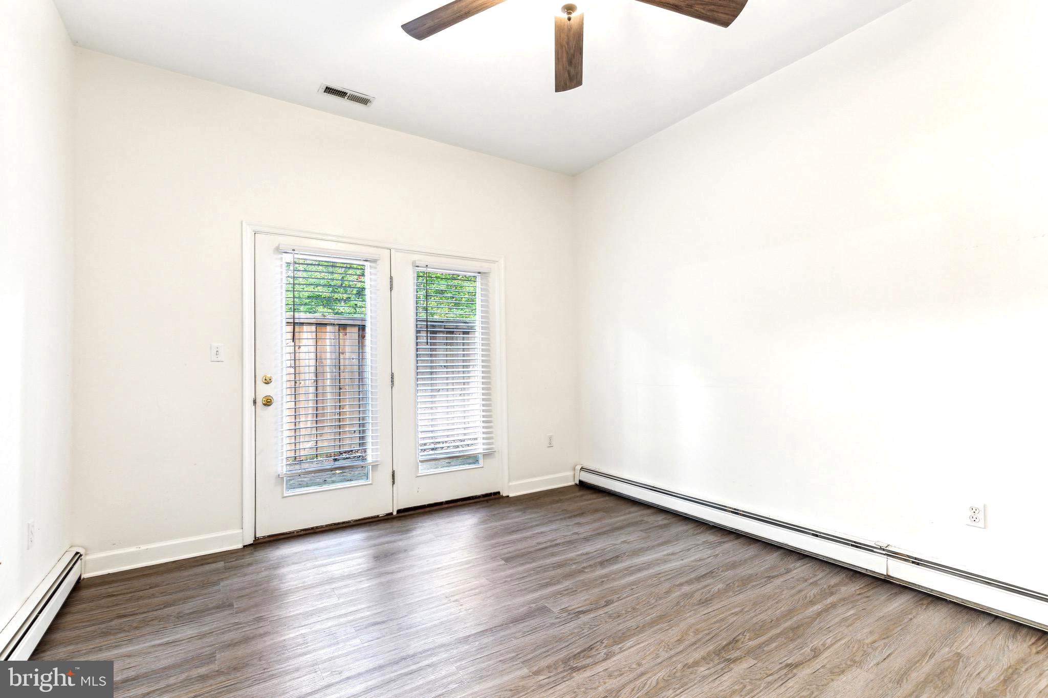 1500 St Margarets Road Annapolis, MD 21409 - Photo 10 of 18 an empty room with wooden floor and windows