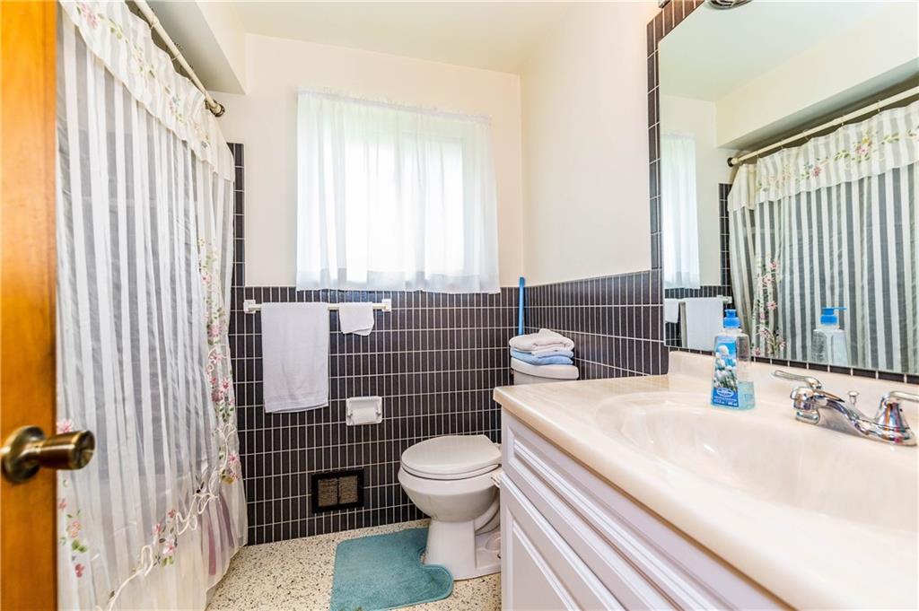 1613 Sharps Hill Road Pittsburgh, PA 15215 - Photo 14 of 22 FULL BATHROOM: Updated with vanity and toilet. Neutral colors and spacious for your needs.