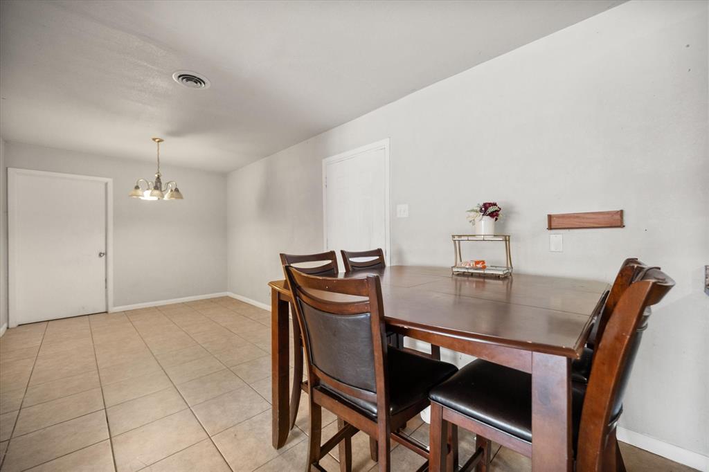 1437 Roma Lane Fort Worth, TX 76134 - Photo 11 of 20 a view of a dining room with furniture