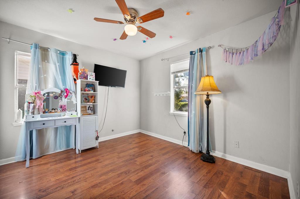 1437 Roma Lane Fort Worth, TX 76134 - Photo 15 of 20 wooden floor in an empty room with a window
