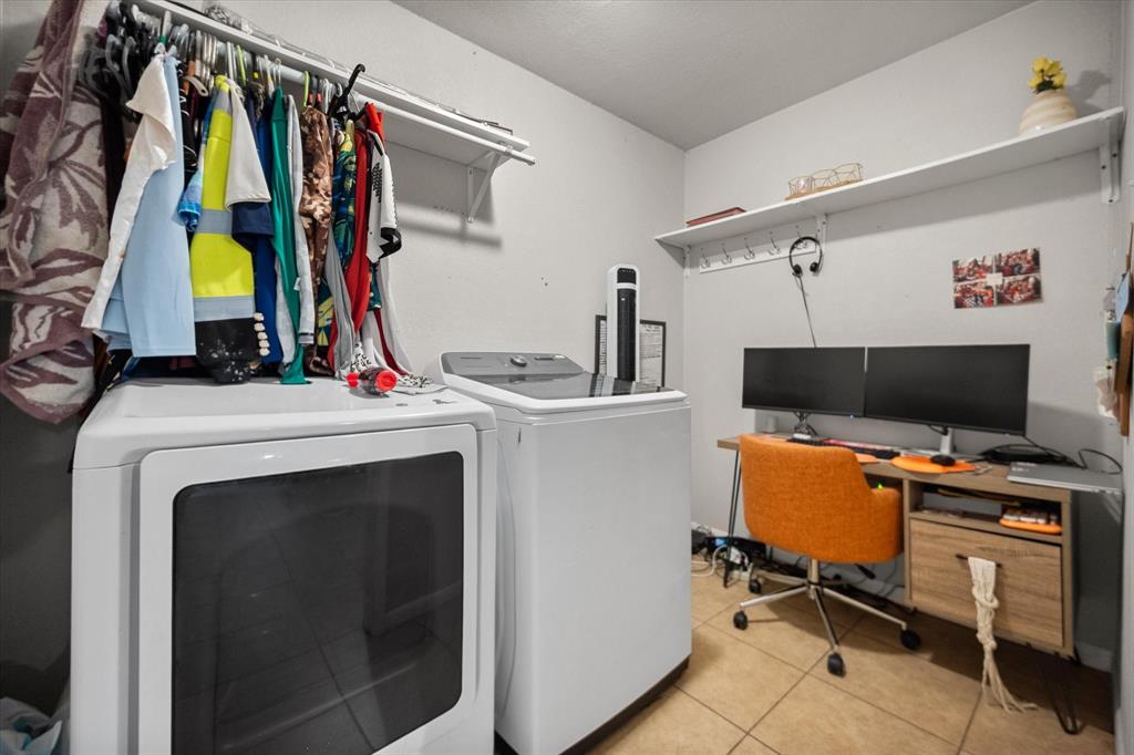 1437 Roma Lane Fort Worth, TX 76134 - Photo 17 of 20 a view of a workspace with furniture and a window