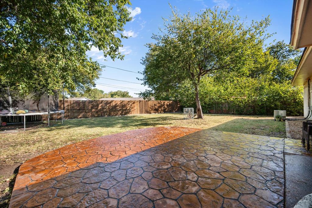 1437 Roma Lane Fort Worth, TX 76134 - Photo 18 of 20 a view of a yard with large trees