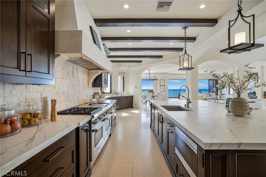 709 Esplanade Redondo Beach, CA 90277 - Photo 13 of 75 a kitchen with stainless steel appliances granite countertop a sink stove and cabinets