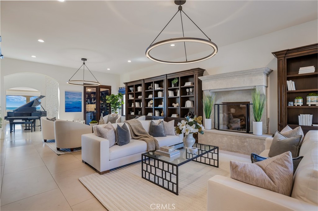 709 Esplanade Redondo Beach, CA 90277 - Photo 16 of 75 a living room with furniture a rug and a chandelier