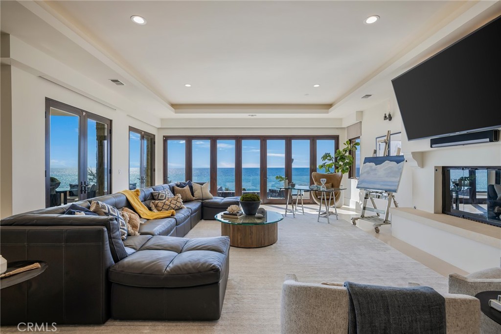 709 Esplanade Redondo Beach, CA 90277 - Photo 18 of 75 a living room with furniture and a flat screen tv