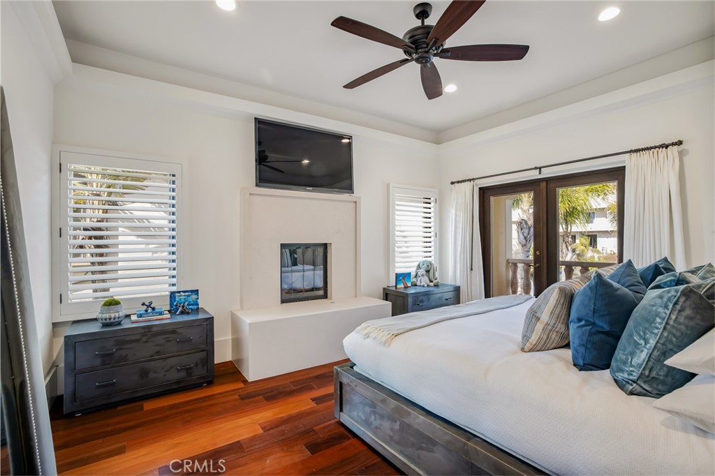 709 Esplanade Redondo Beach, CA 90277 - Photo 43 of 75 a bedroom with a large bed and a tv