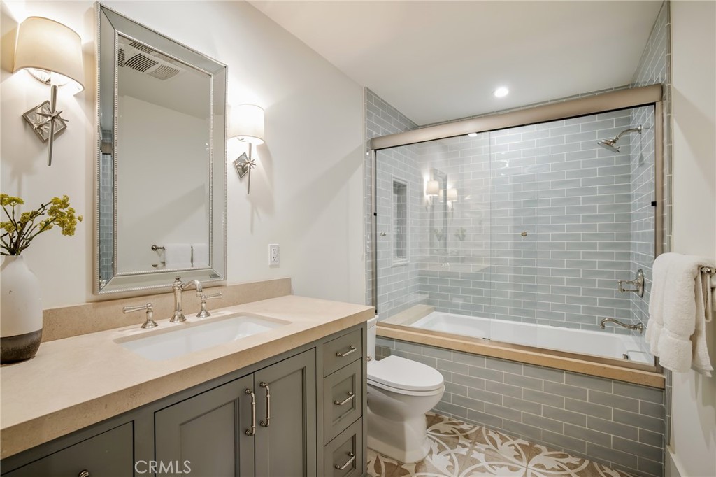 709 Esplanade Redondo Beach, CA 90277 - Photo 44 of 75 a bathroom with a granite countertop sink toilet and shower