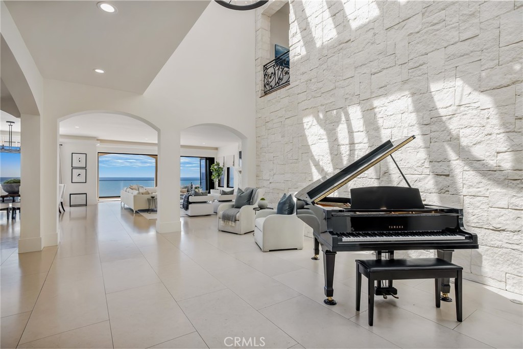 709 Esplanade Redondo Beach, CA 90277 - Photo 5 of 75 a living room with furniture a piano and a potted plant