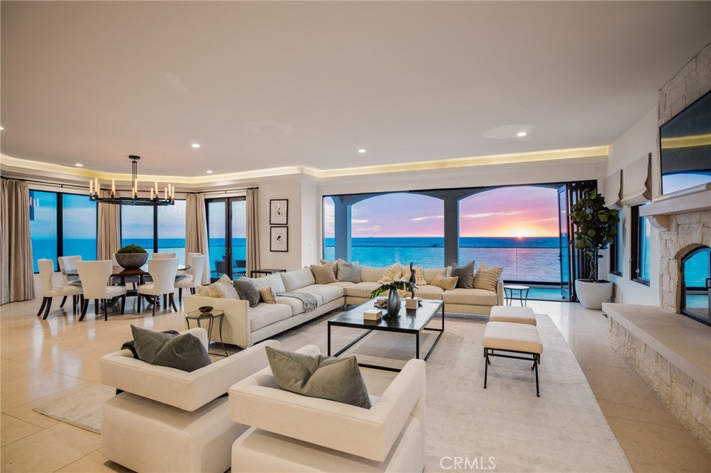 709 Esplanade Redondo Beach, CA 90277 - Photo 61 of 75 a living room with furniture large windows and a fireplace