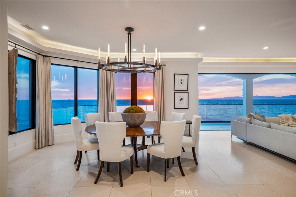 709 Esplanade Redondo Beach, CA 90277 - Photo 63 of 75 a view of a dining room with furniture large windows and wooden floor