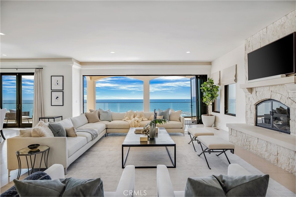 709 Esplanade Redondo Beach, CA 90277 - Photo 7 of 75 a living room with fireplace furniture and a flat screen tv