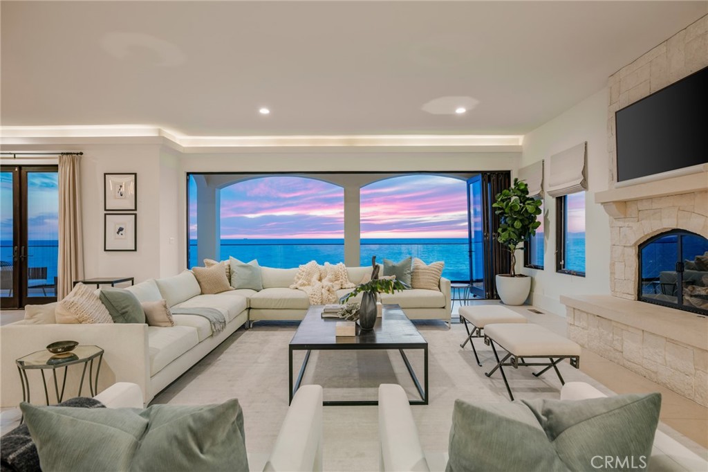 709 Esplanade Redondo Beach, CA 90277 - Photo 72 of 75 a living room with furniture a fireplace and a flat screen tv