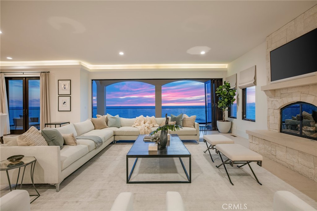 709 Esplanade Redondo Beach, CA 90277 - Photo 73 of 75 a living room with furniture a fireplace and a flat screen tv