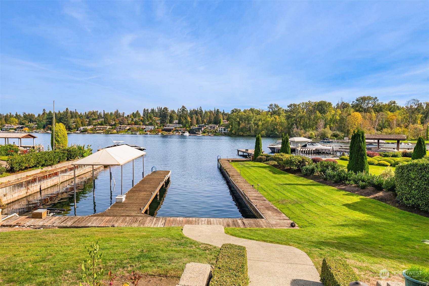 3252 Hunts Point Road Hunts Point, WA 98004 - Photo 17 of 21 a view of a lake with houses in the back