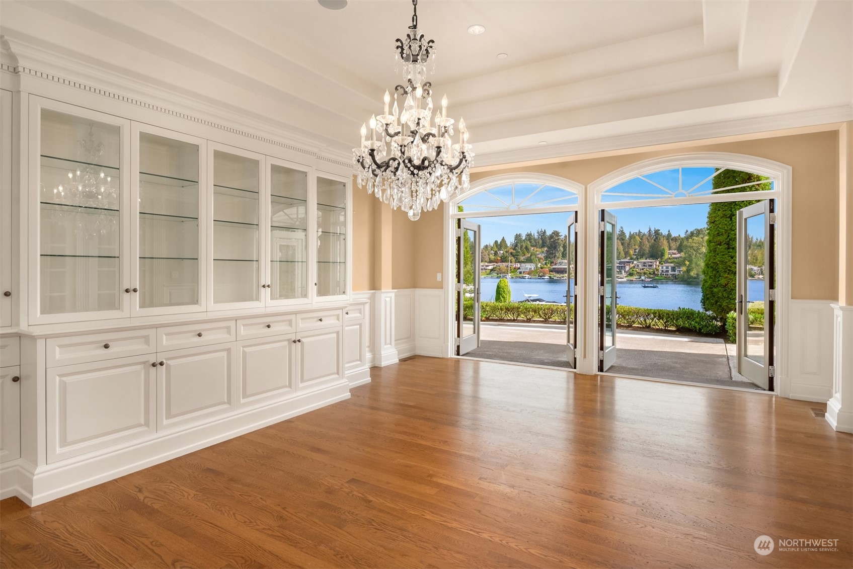3252 Hunts Point Road Hunts Point, WA 98004 - Photo 7 of 21 a view of an empty room with wooden floor and a window