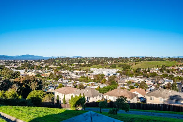 a bedroom with two beds and a window