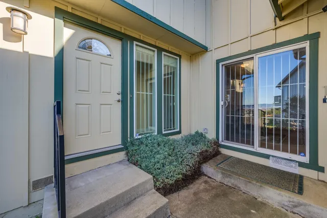 a living room with furniture window and a fireplace