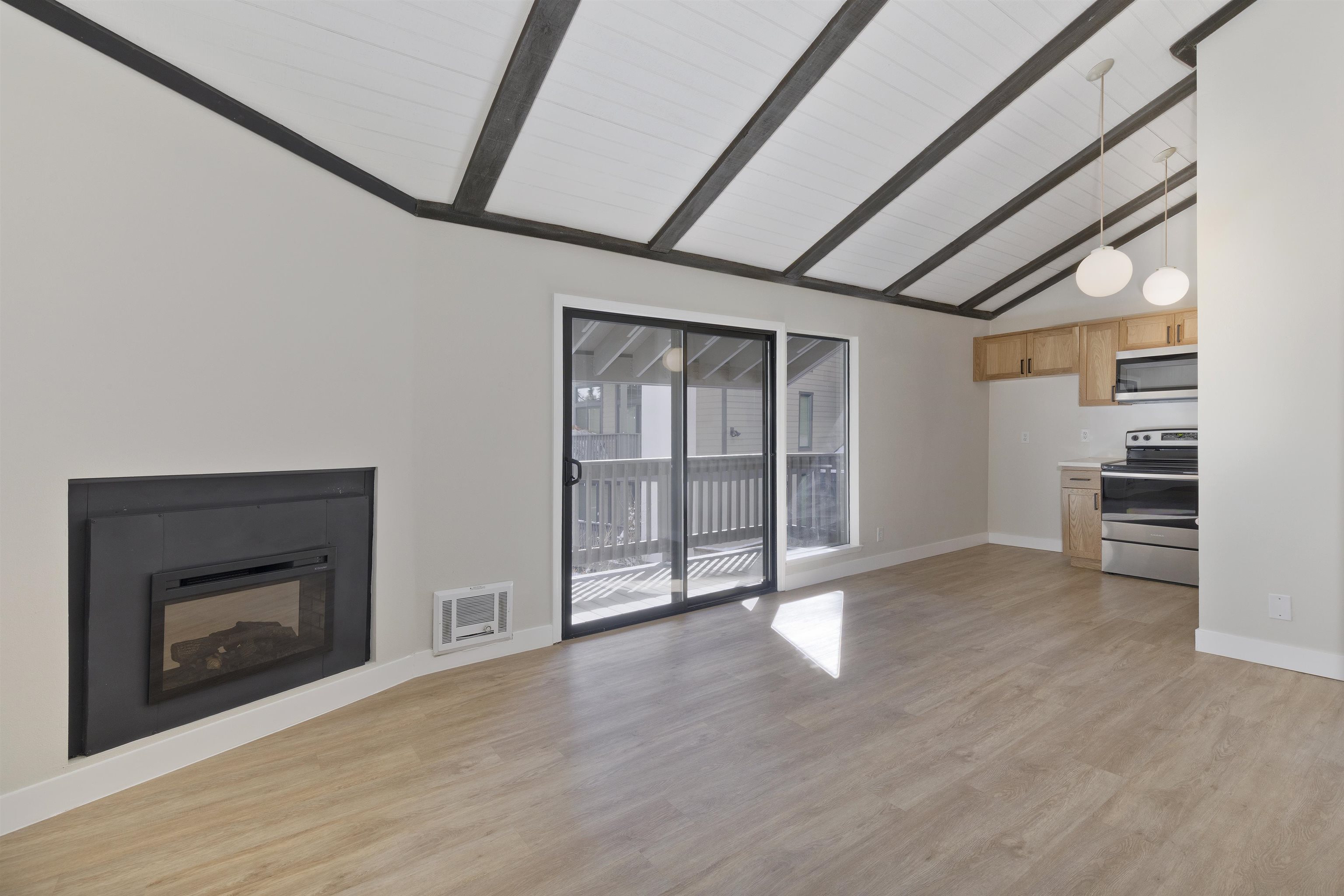 362 Old Mammoth Road, Unit 58 Mammoth Lakes, CA 93546 - Photo 2 of 26 a view of an empty room with a fireplace and a window