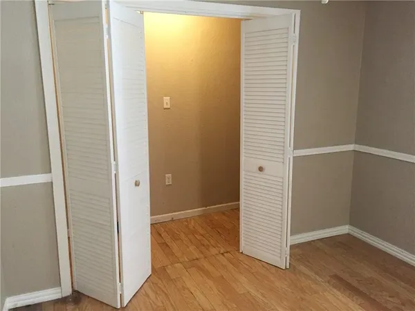 an empty room with wooden floor