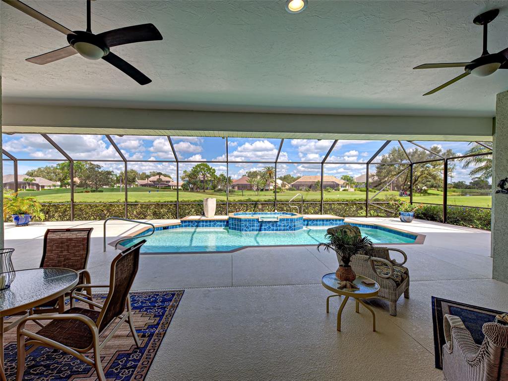 431 Tremingham Way Venice, FL 34293 - Photo 25 of 66 a roof deck with couch and city view