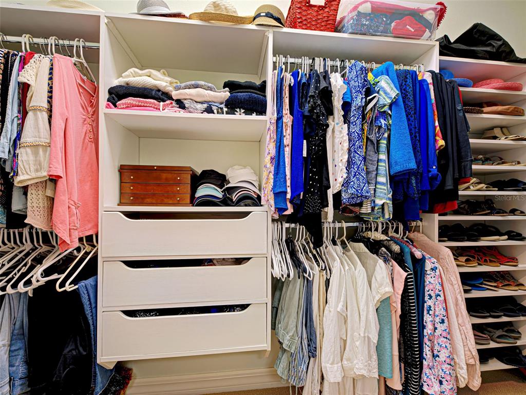 431 Tremingham Way Venice, FL 34293 - Photo 36 of 66 a view of walk in closet with clothes and shoes