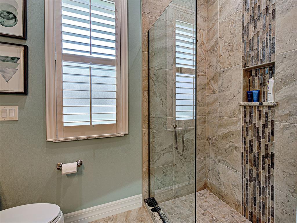 431 Tremingham Way Venice, FL 34293 - Photo 54 of 66 a bathroom with a shower and a toilet