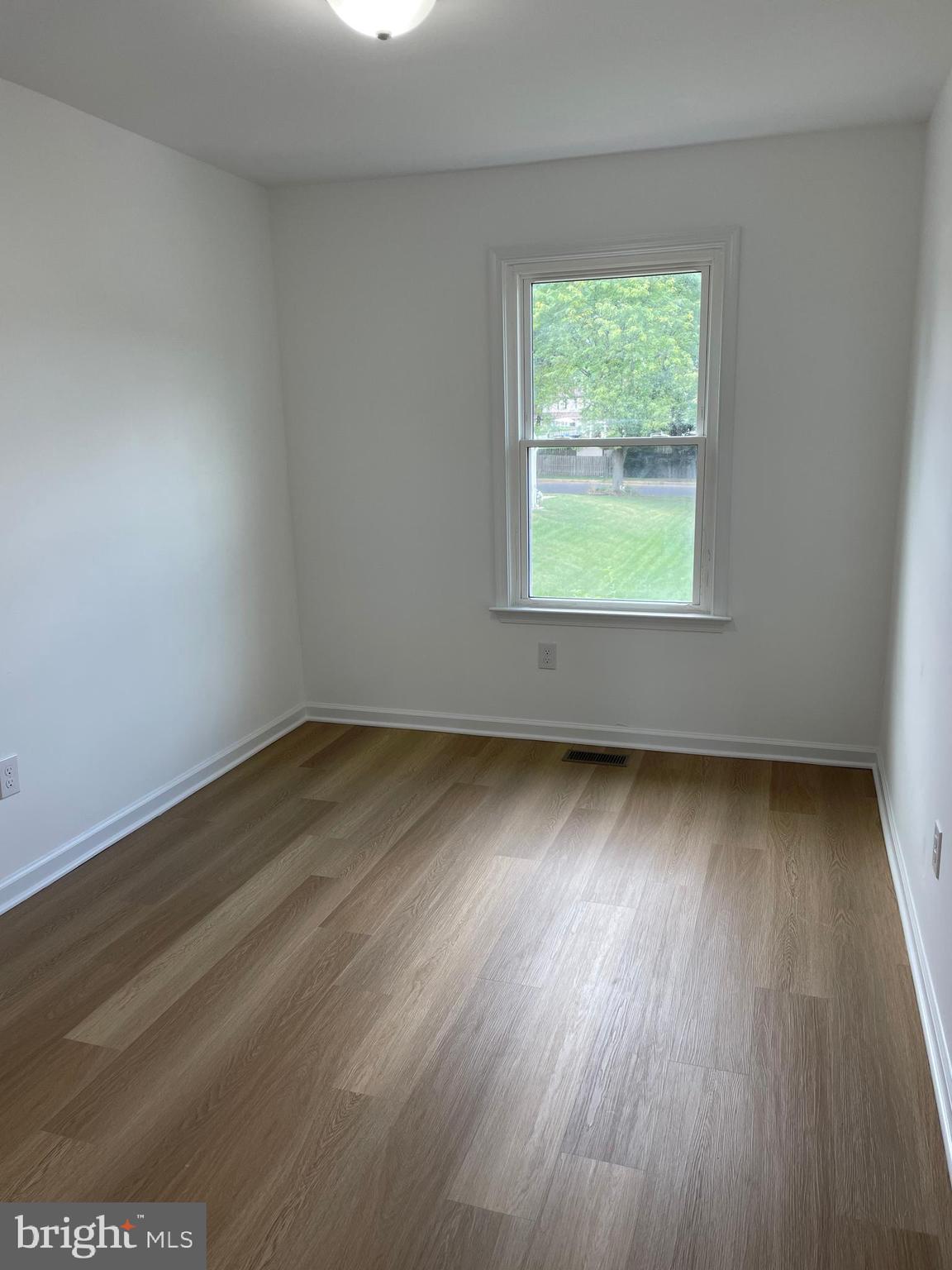 22 Winstead Drive Westampton, NJ 08060 - Photo 25 of 35 an empty room with wooden floor and windows