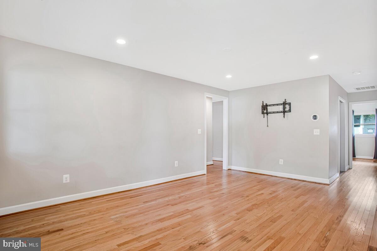 1533 Wakefield Road Edgewater, MD 21037 - Photo 15 of 41 a view of an empty room with wooden floor